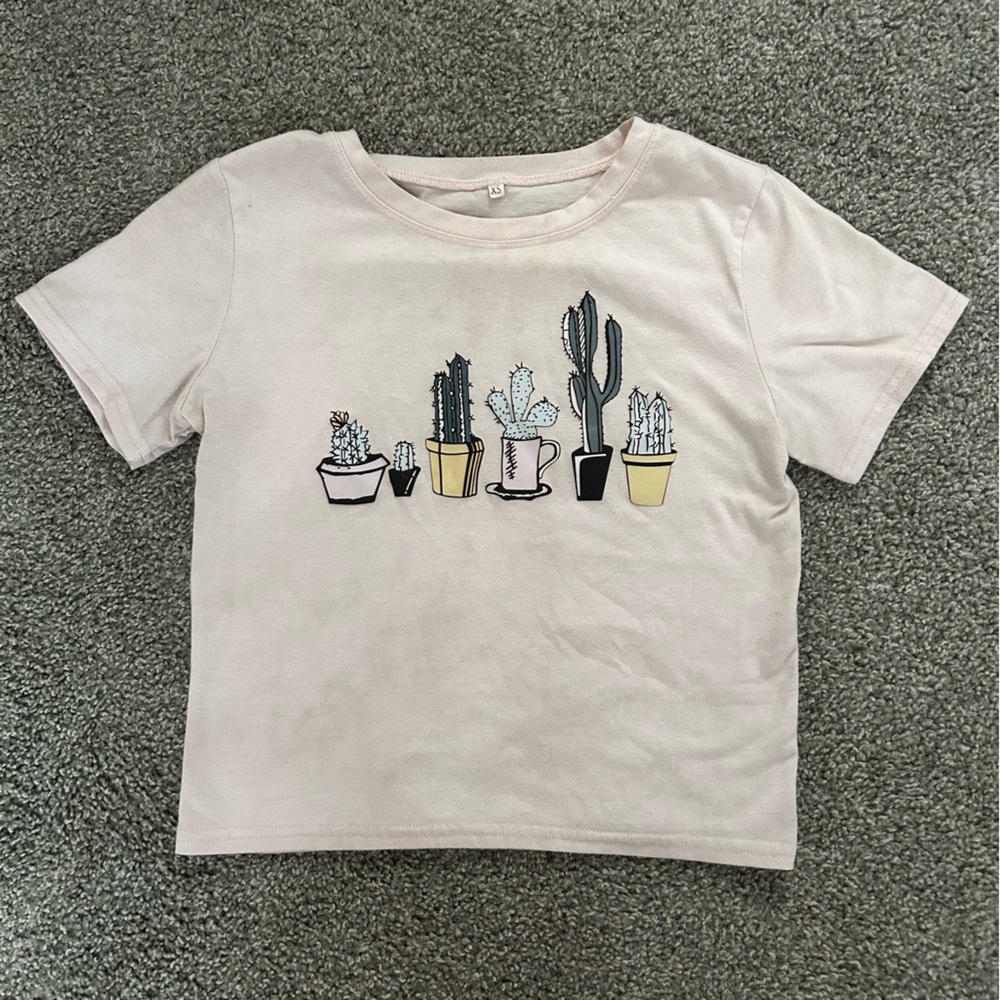Light pink cropped t-shirt with cactus images.